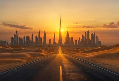 Sunset City Skyline with Desert Road