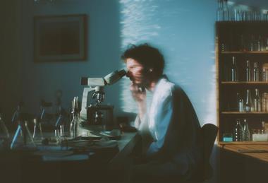 Scientist at Microscope