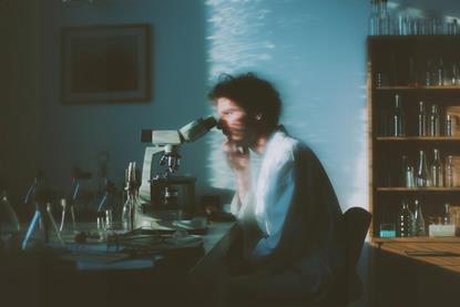 Scientist at Microscope