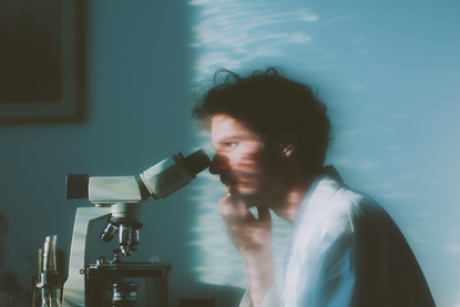 Scientist at Microscope