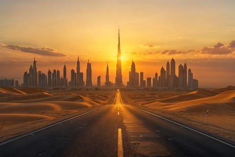 Sunset City Skyline with Desert Road