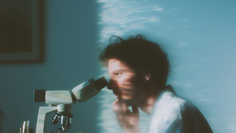 Scientist at Microscope