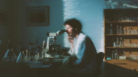 Scientist at Microscope