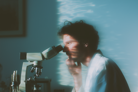 Scientist at Microscope